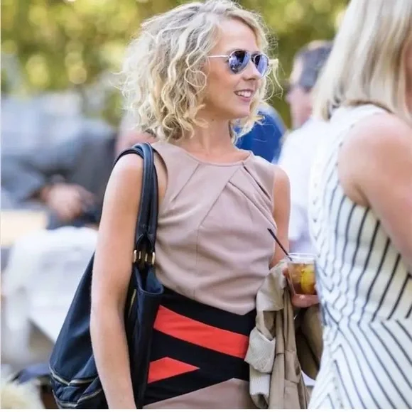 Tan bandage dress with bright orange and black waist detailing. - Picture 3 of 7
